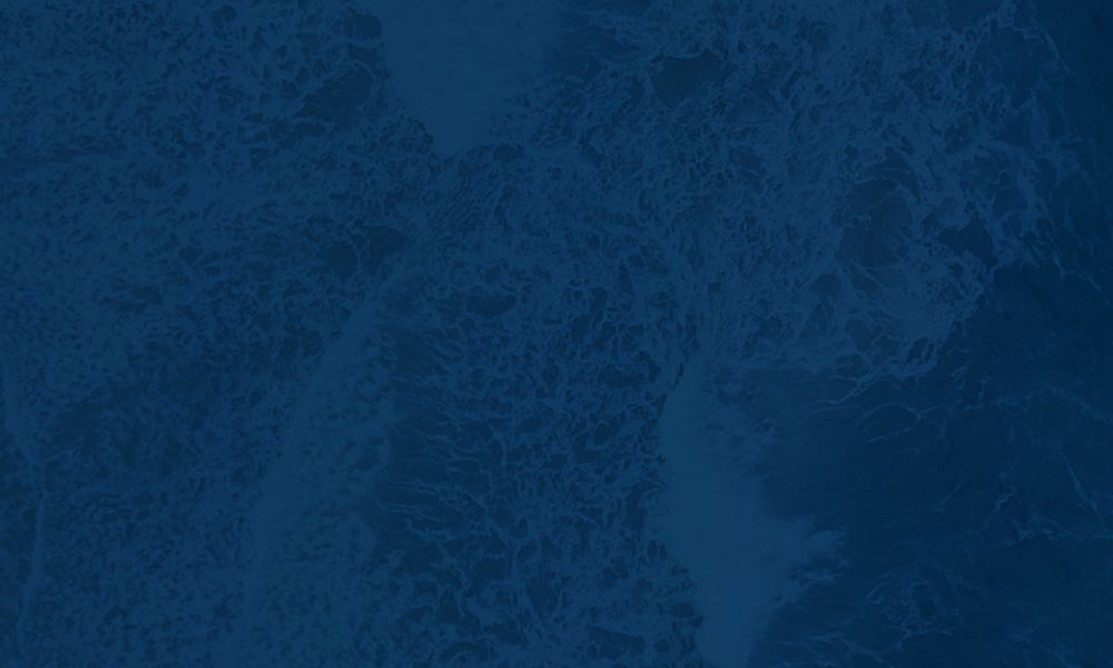 Deep blue ocean waves creating textured patterns, conveying a sense of calm and depth.